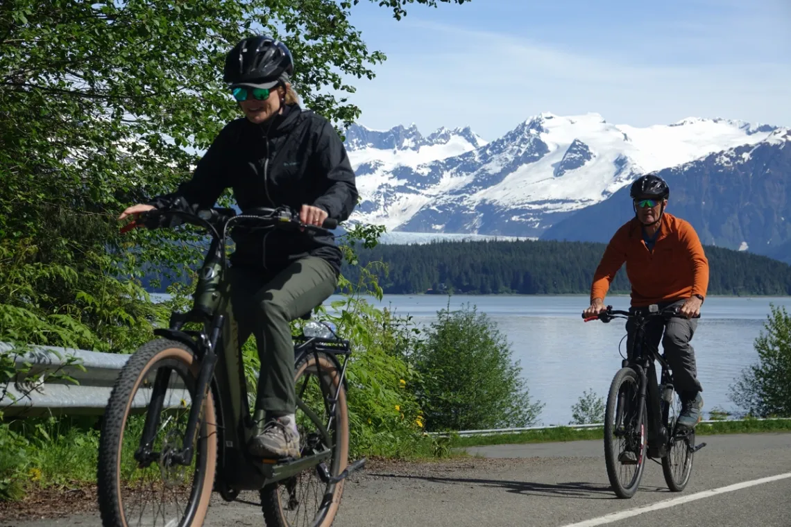 1200x800 Juneau alaska rainforest ebike couple uphill mountain ocean