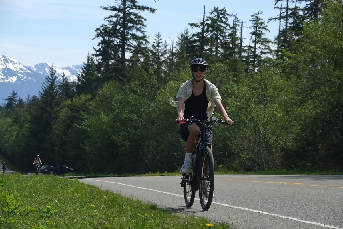 1200x800 Juneau rainforest ebike forest mountain view young man