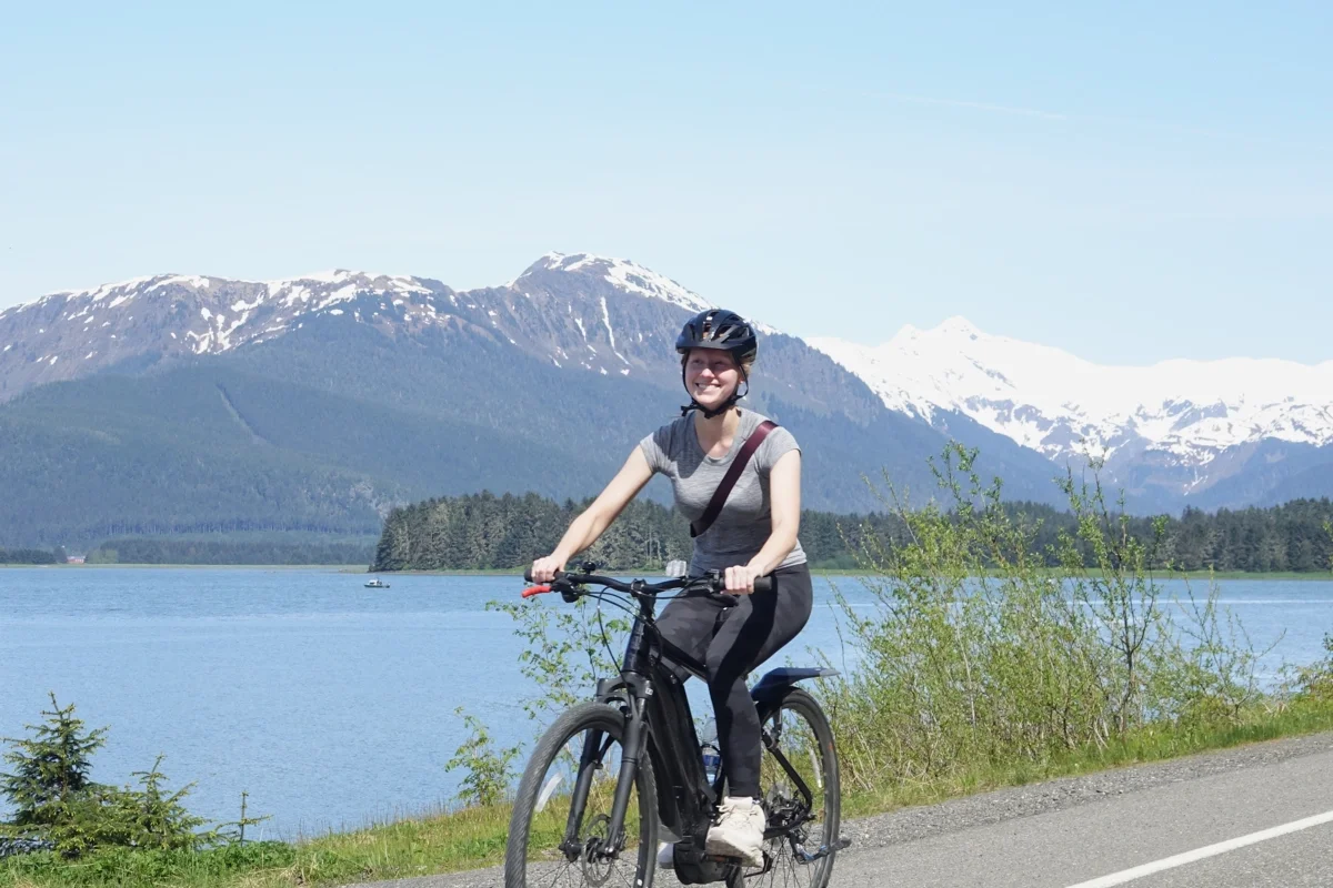 1200x800 Juneau rainforest ebike smiling woman ocean view